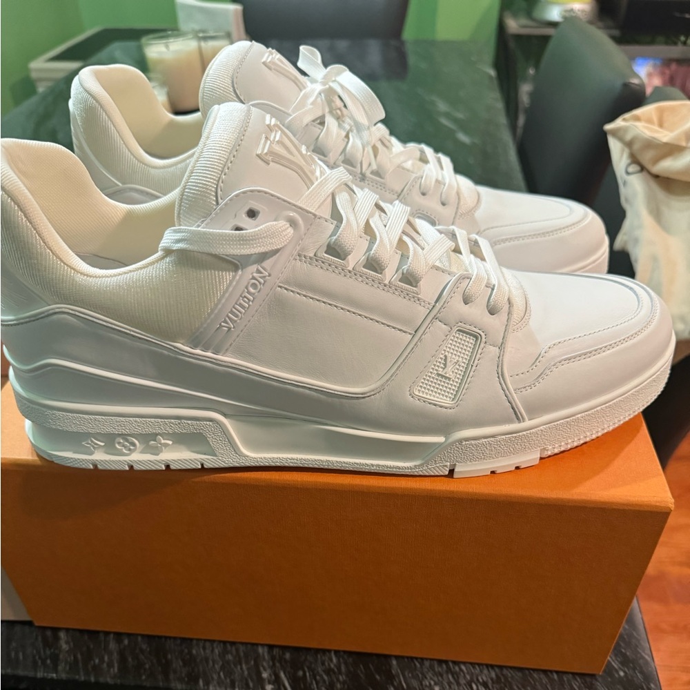 A pair of Louis Vuttion sneakers